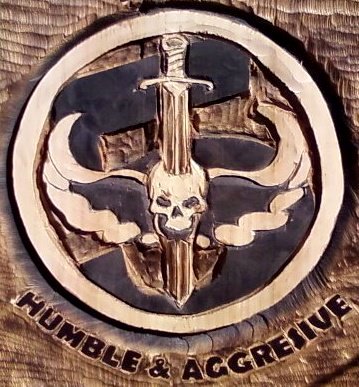 2011-08-18-HumbleSeal-Chainsaw-Carved-Seal-Swords-1.jpg